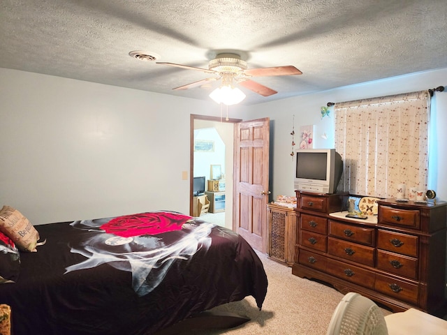 6416 Jimary Ln, Gladwin, MI 48624 - bedroom featuring carpet floors, ceiling fan, and a textured ceiling