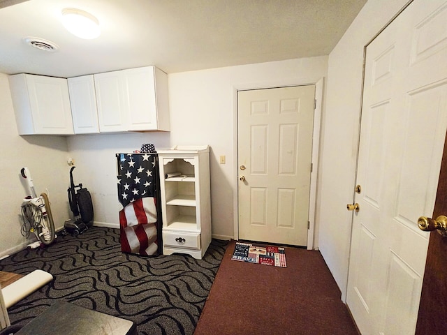 6416 Jimary Ln, Gladwin, MI 48624 - laundry room featuring carpet floors