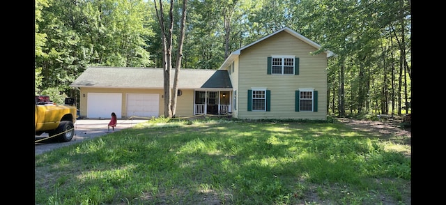 6119 W Nestel Rd, Houghton Lake, MI 48629 - traditional home featuring a garage, driveway, and a front lawn