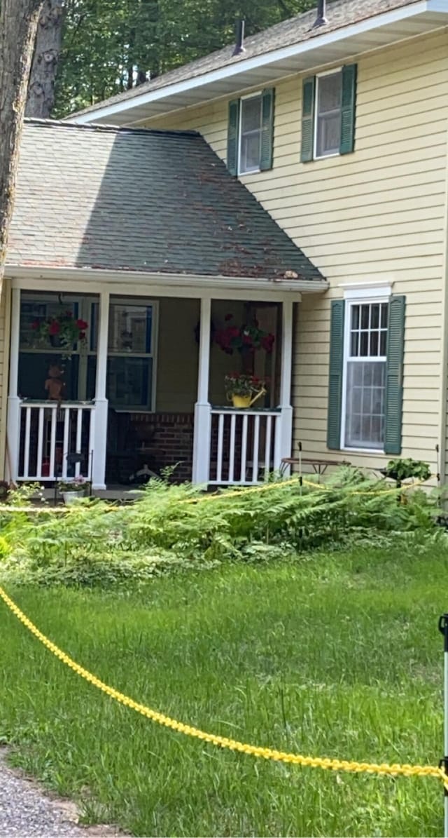 6119 W Nestel Rd, Houghton Lake, MI 48629 - back of house featuring covered porch