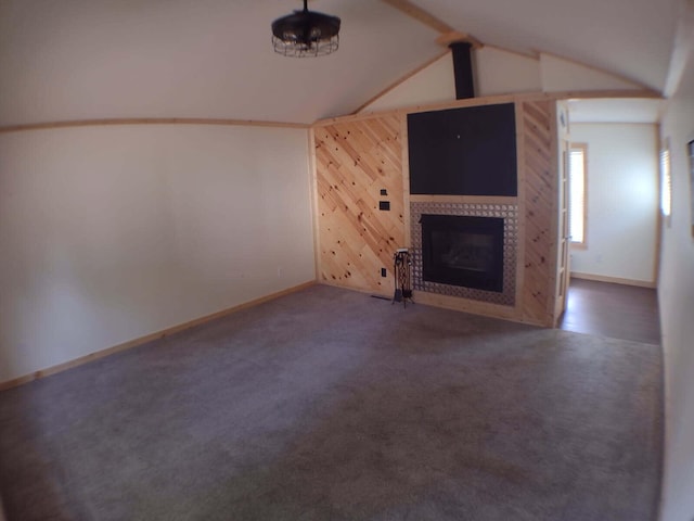 117 Vienna Ct, Houghton Lake, MI 48629 - unfurnished living room with wood walls, a fireplace, and carpet