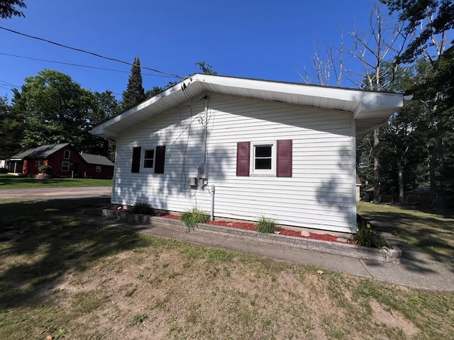 332 Pingree St, Roscommon, MI 48653 - view of property exterior with a lawn