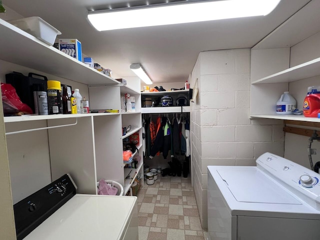 332 Pingree St, Roscommon, MI 48653 - washroom featuring washer and clothes dryer, light flooring, and concrete block wall