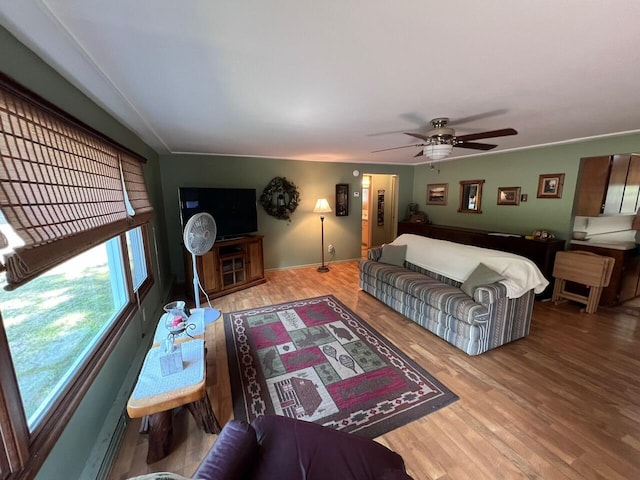332 Pingree St, Roscommon, MI 48653 - living area featuring wood finished floors and ceiling fan