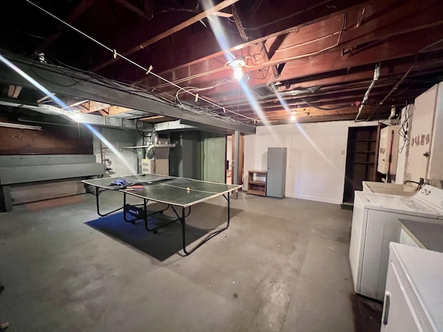 1003 Ada St, Owosso, MI 48867 - unfinished basement featuring washing machine and dryer