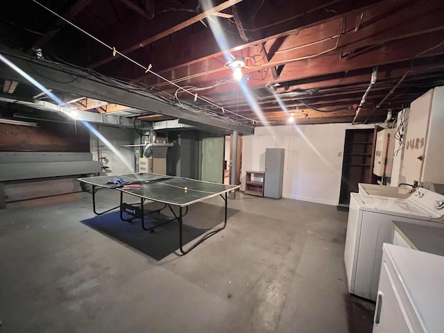 1003 Ada St, Owosso, MI 48867 - unfinished below grade area featuring washer and clothes dryer and water heater