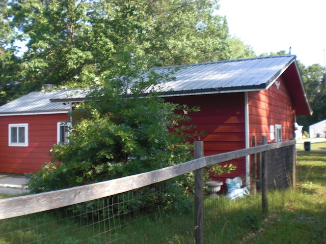 557 Davis St, Lake, MI 48632 - view of property exterior with a metal roof