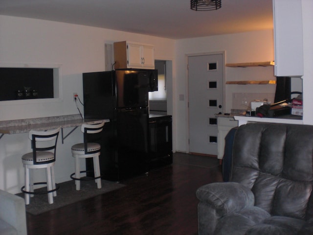 557 Davis St, Lake, MI 48632 - living room with dark wood-type flooring