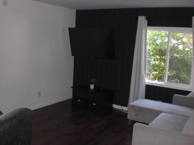 557 Davis St, Lake, MI 48632 - living room with dark wood-style flooring and plenty of natural light