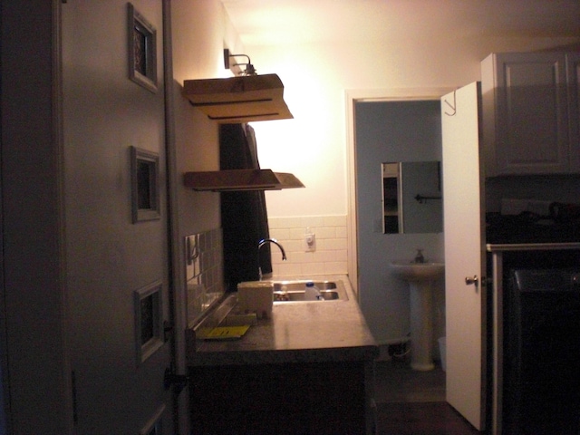 557 Davis St, Lake, MI 48632 - kitchen with range hood, open shelves, and decorative backsplash