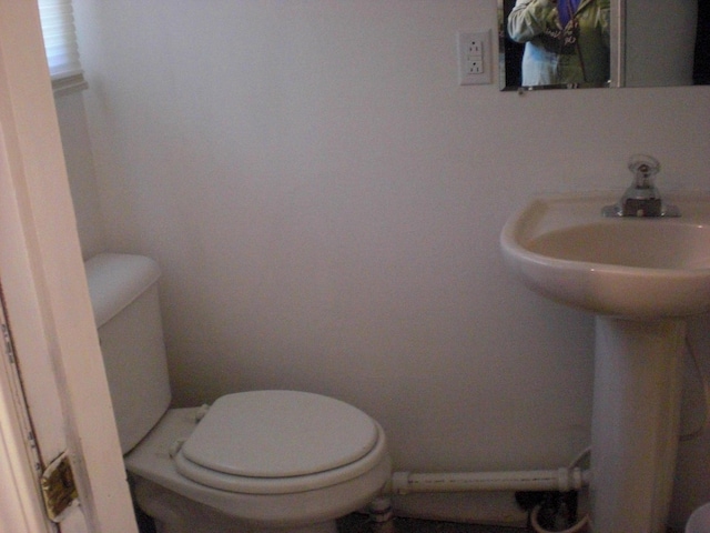 557 Davis St, Lake, MI 48632 - half bathroom featuring toilet