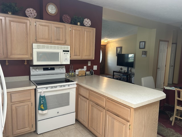 362 N Addison St, Alpena, MI 49707 - kitchen featuring white appliances, a peninsula, light brown cabinetry, light countertops, and light tile patterned flooring