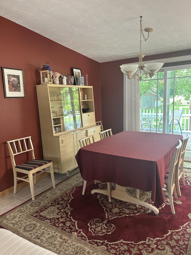 362 N Addison St, Alpena, MI 49707 - dining area featuring a textured ceiling and a chandelier