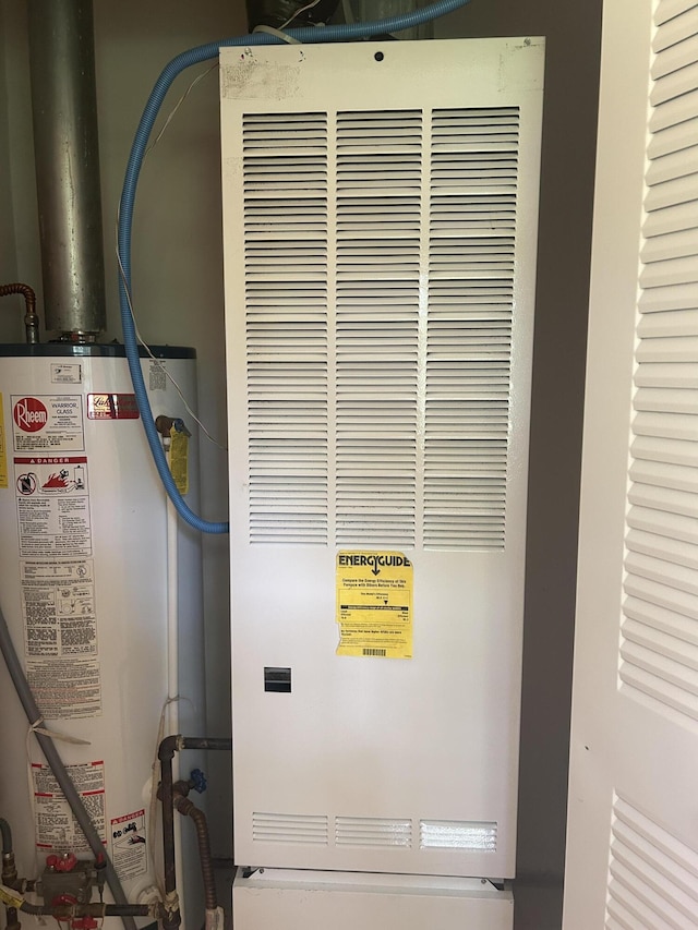 362 N Addison St, Alpena, MI 49707 - utility room with a heating unit and water heater