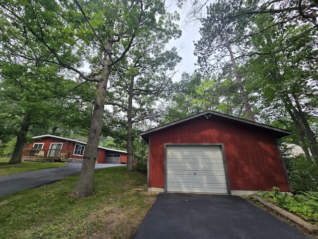 1300 Geesey Ave, Mio, MI 48647 - detached garage featuring asphalt driveway