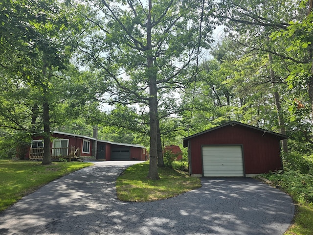 1300 Geesey Ave, Mio, MI 48647 - single story home featuring an outbuilding and a front yard