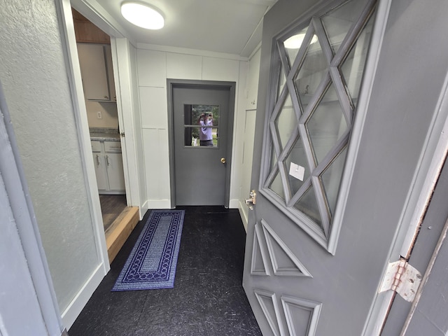 1300 Geesey Ave, Mio, MI 48647 - doorway to outside featuring baseboards
