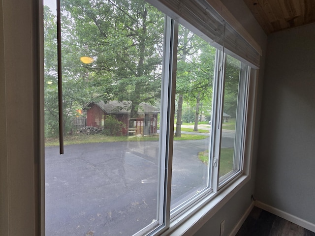 1300 Geesey Ave, Mio, MI 48647 - doorway to outside featuring plenty of natural light and wood finished floors