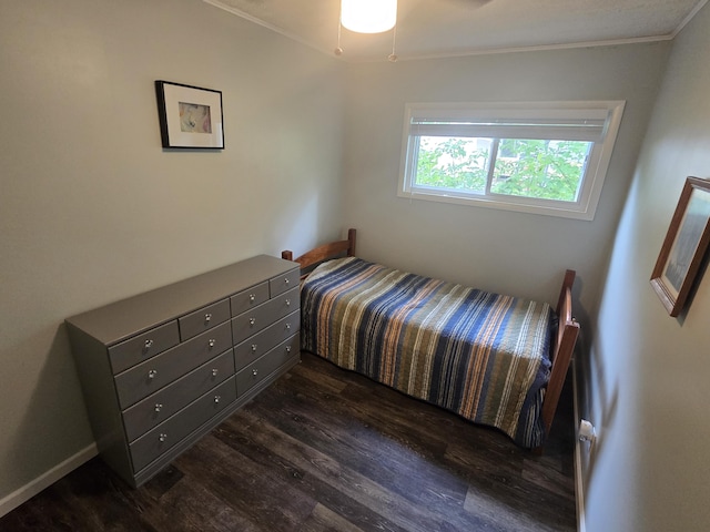 1300 Geesey Ave, Mio, MI 48647 - bedroom featuring dark wood finished floors and ornamental molding