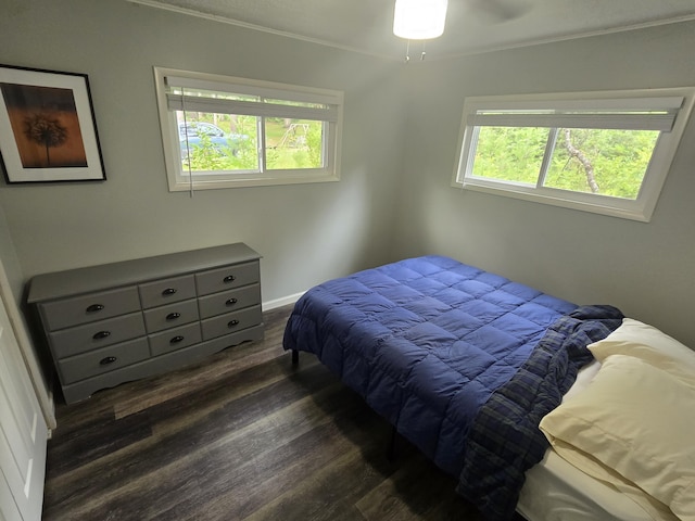 1300 Geesey Ave, Mio, MI 48647 - bedroom featuring dark wood-style flooring and ornamental molding