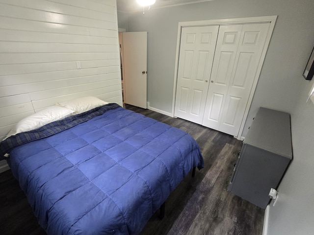 1300 Geesey Ave, Mio, MI 48647 - bedroom featuring dark wood finished floors and a closet