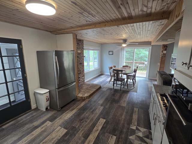 1300 Geesey Ave, Mio, MI 48647 - kitchen featuring freestanding refrigerator, white cabinets, a ceiling fan, dark wood-style flooring, and wall oven