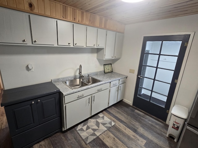 1300 Geesey Ave, Mio, MI 48647 - kitchen with white cabinetry, dark wood-type flooring, light countertops, and wood ceiling