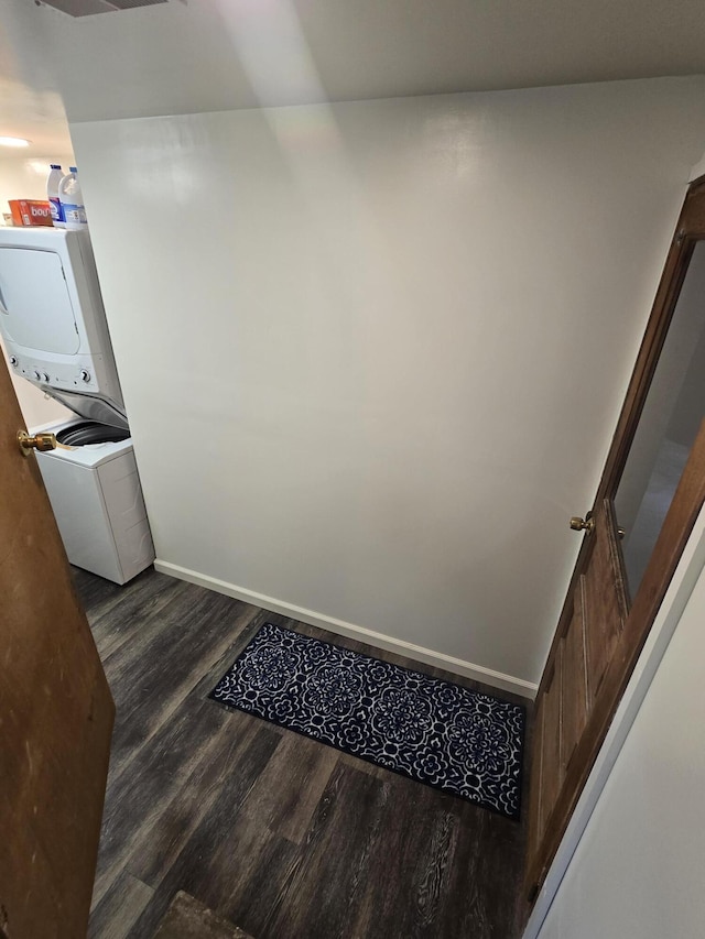1300 Geesey Ave, Mio, MI 48647 - interior space with estacked washer and dryer and wood finished floors