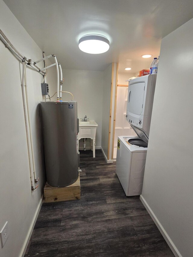 1300 Geesey Ave, Mio, MI 48647 - washroom featuring water heater, stacked washer and clothes dryer, dark wood-style flooring, and recessed lighting