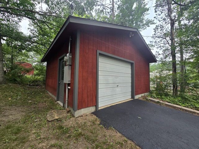1300 Geesey Ave, Mio, MI 48647 - garage featuring asphalt driveway