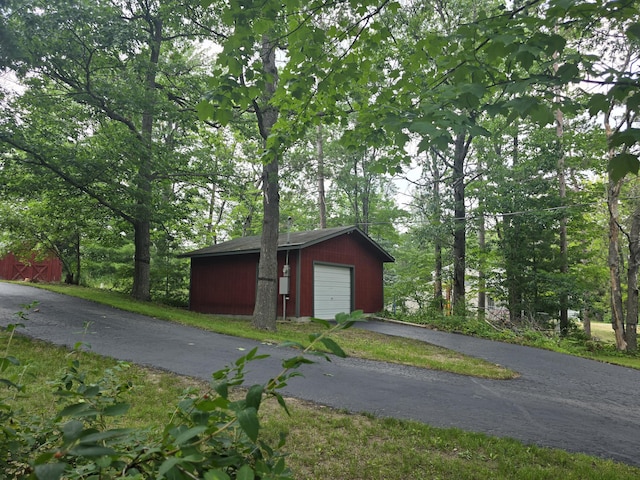 1300 Geesey Ave, Mio, MI 48647 - detached garage with asphalt driveway