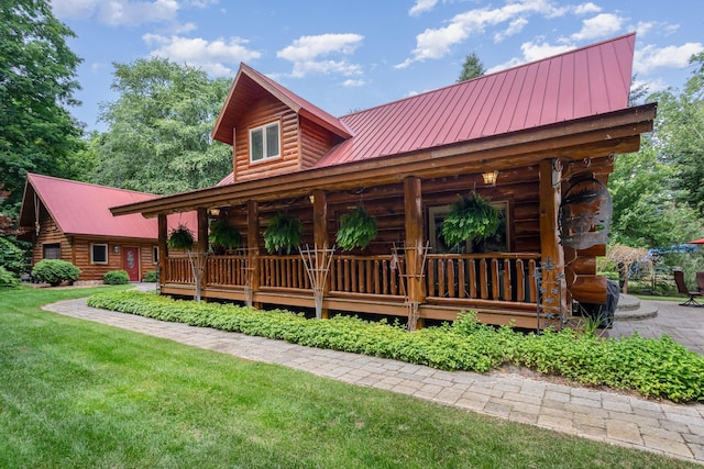 23 Treasure Is, Roscommon, MI 48653 - cabin with log exterior, a metal roof, a front lawn, and a porch
