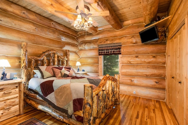 23 Treasure Is, Roscommon, MI 48653 - bedroom featuring hardwood / wood-style flooring, a wood ceiling with exposed beams, and rustic walls