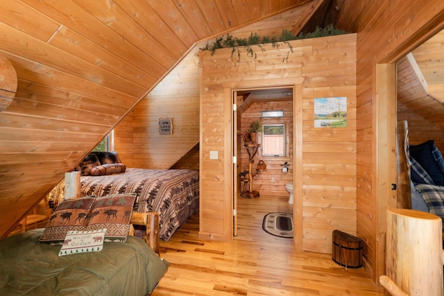 23 Treasure Is, Roscommon, MI 48653 - bedroom with vaulted ceiling, wooden ceiling, wood walls, and light wood finished floors