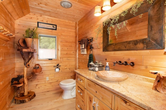 23 Treasure Is, Roscommon, MI 48653 - bathroom with vanity, wood ceiling, wooden walls, and wood finished floors