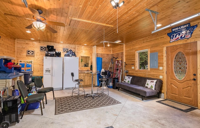 23 Treasure Is, Roscommon, MI 48653 - garage with white refrigerator with ice dispenser, electric panel, wooden walls, ceiling fan, and wood ceiling