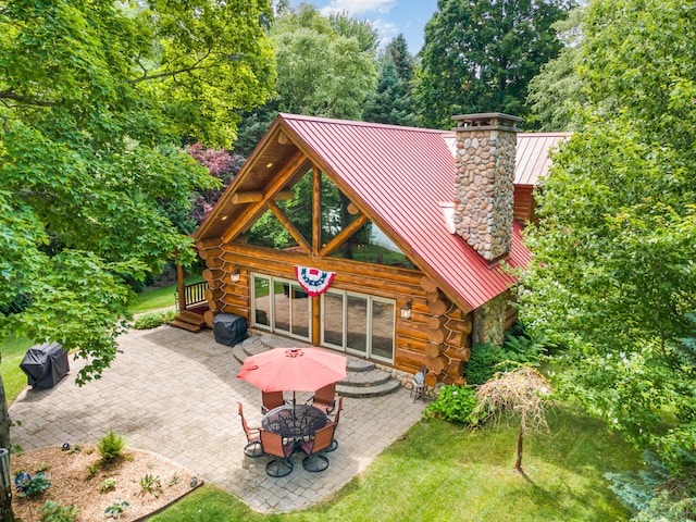 23 Treasure Is, Roscommon, MI 48653 - view of patio / terrace featuring a fire pit and area for grilling