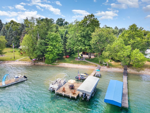 23 Treasure Is, Roscommon, MI 48653 - dock area with a water view and view of scattered trees