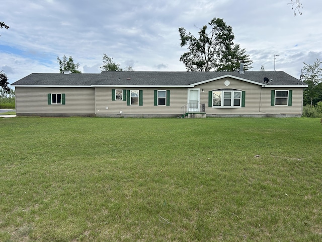 2503 W Hubbard Lake Trl, Hubbard Lake, MI 49747 - manufactured / mobile home featuring a front lawn