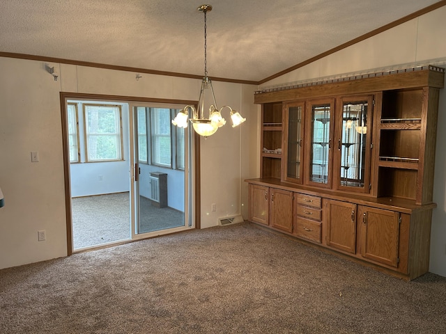 2503 W Hubbard Lake Trl, Hubbard Lake, MI 49747 - unfurnished dining area with crown molding, vaulted ceiling, carpet, a chandelier, and a textured ceiling