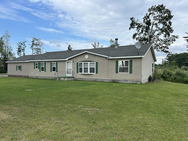 2503 W Hubbard Lake Trl, Hubbard Lake, MI 49747 - view of front of home featuring crawl space, a front lawn, and roof with shingles