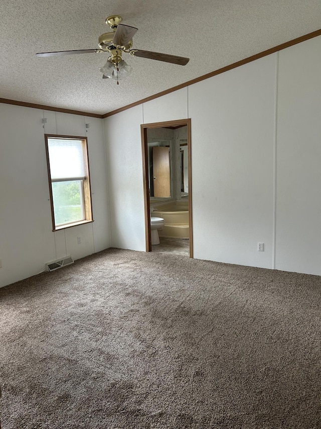 2503 W Hubbard Lake Trl, Hubbard Lake, MI 49747 - carpeted spare room featuring crown molding, lofted ceiling, a textured ceiling, and a ceiling fan