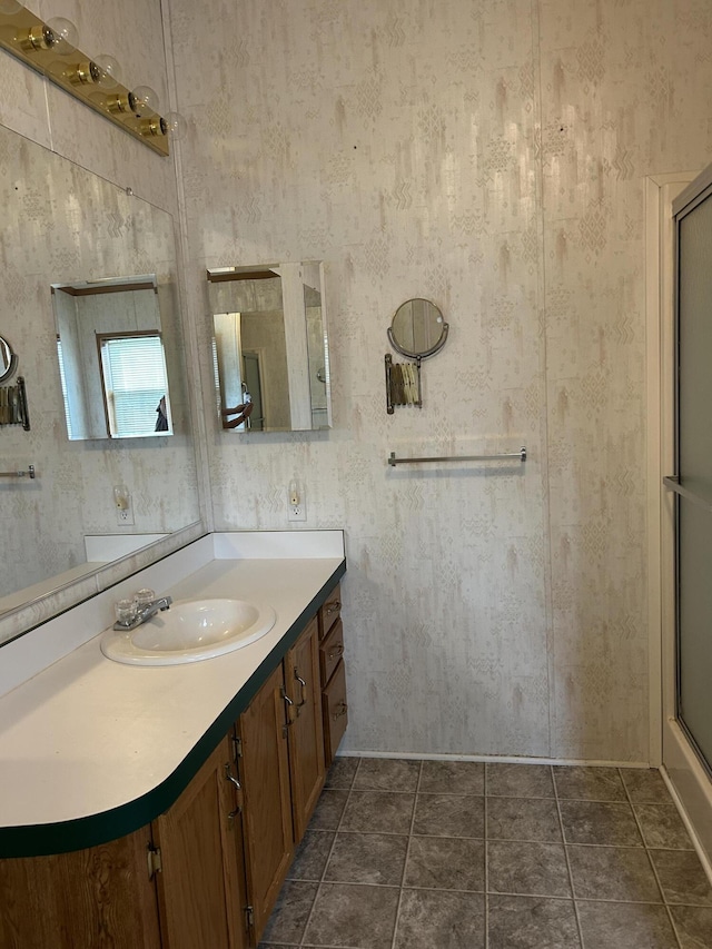 2503 W Hubbard Lake Trl, Hubbard Lake, MI 49747 - full bath featuring vanity and a shower with shower door