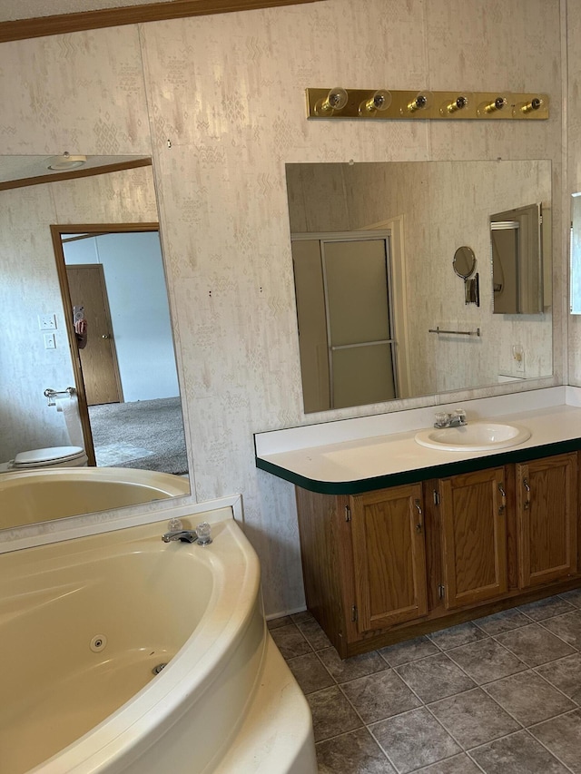 2503 W Hubbard Lake Trl, Hubbard Lake, MI 49747 - full bath featuring a whirlpool tub, vanity, and tile patterned flooring