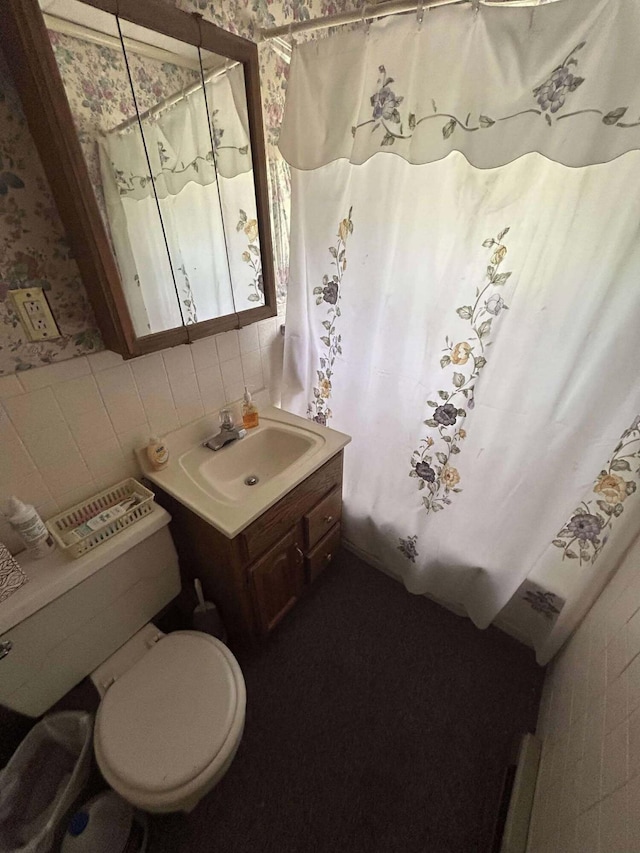 302 S Vine St, Mio, MI 48647 - bathroom featuring vanity, a shower with shower curtain, and wallpapered walls