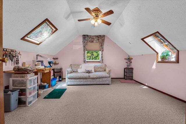 2951 N Palmer Rd, Onaway, MI 49765 - living area featuring a textured ceiling, carpet flooring, lofted ceiling, and a ceiling fan