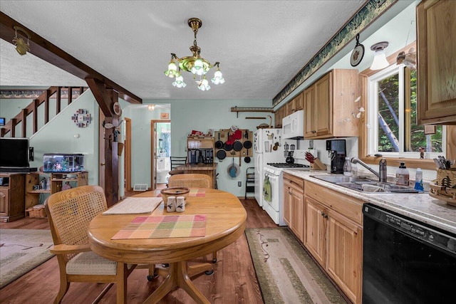 2951 N Palmer Rd, Onaway, MI 49765 - kitchen featuring white appliances, a textured ceiling, a chandelier, wood finished floors, and light countertops