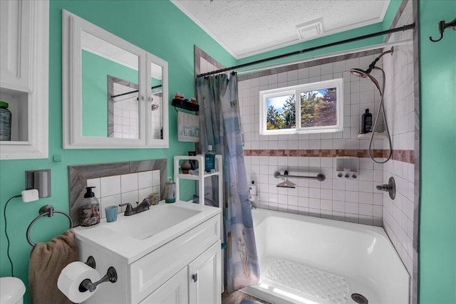 2951 N Palmer Rd, Onaway, MI 49765 - full bath with a textured ceiling, vanity, shower / bath combo, and ornamental molding