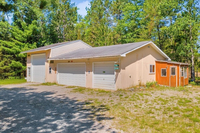 2951 N Palmer Rd, Onaway, MI 49765 - view of property exterior with a garage