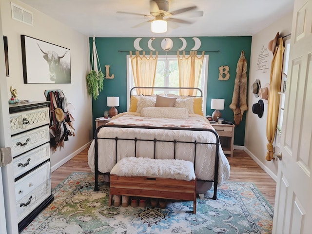 13631 Tolan Rd, Ossineke, MI 49766 - bedroom with wood finished floors and a ceiling fan